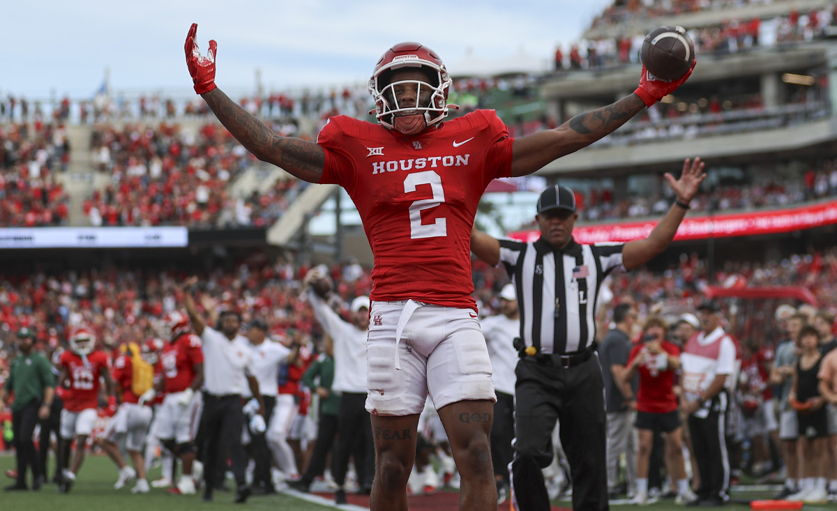 Oct 21, 2023; Houston, Texas, USA; Houston Cougars wide receiver Matthew Golden (2) celebrates after scoring a touchdown during the third quarter against the Texas Longhorns at TDECU Stadium.